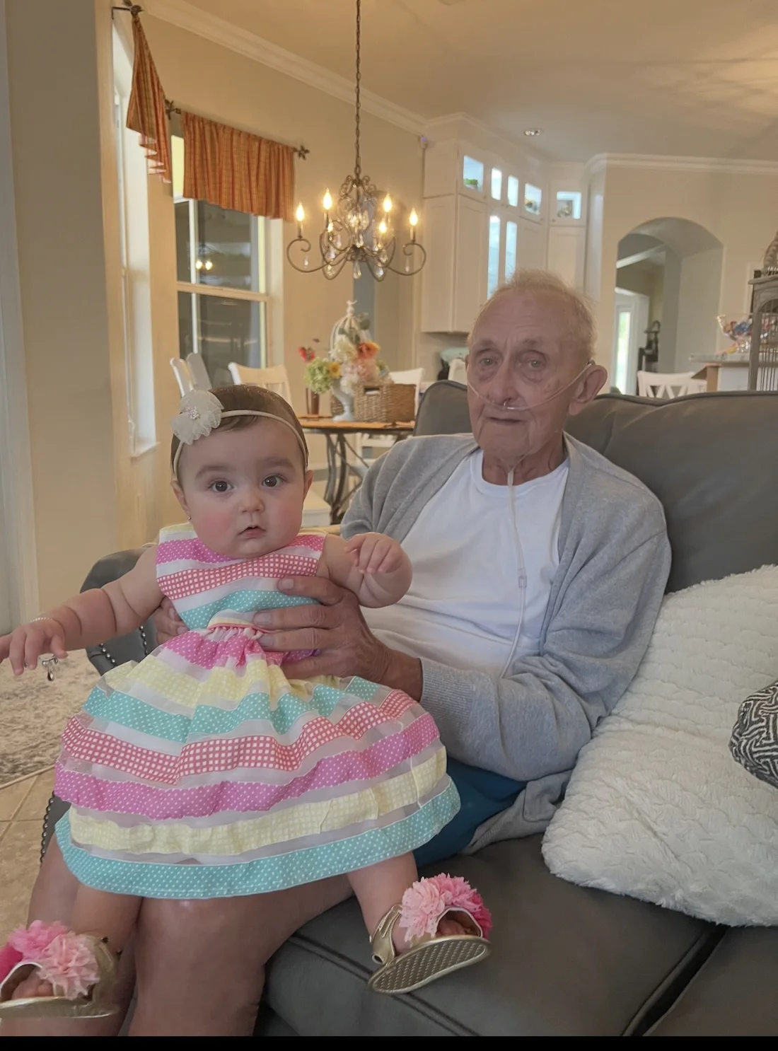 Aubrey sitting with her great-grandfather, Bumpa, in their last photo together in 2023.